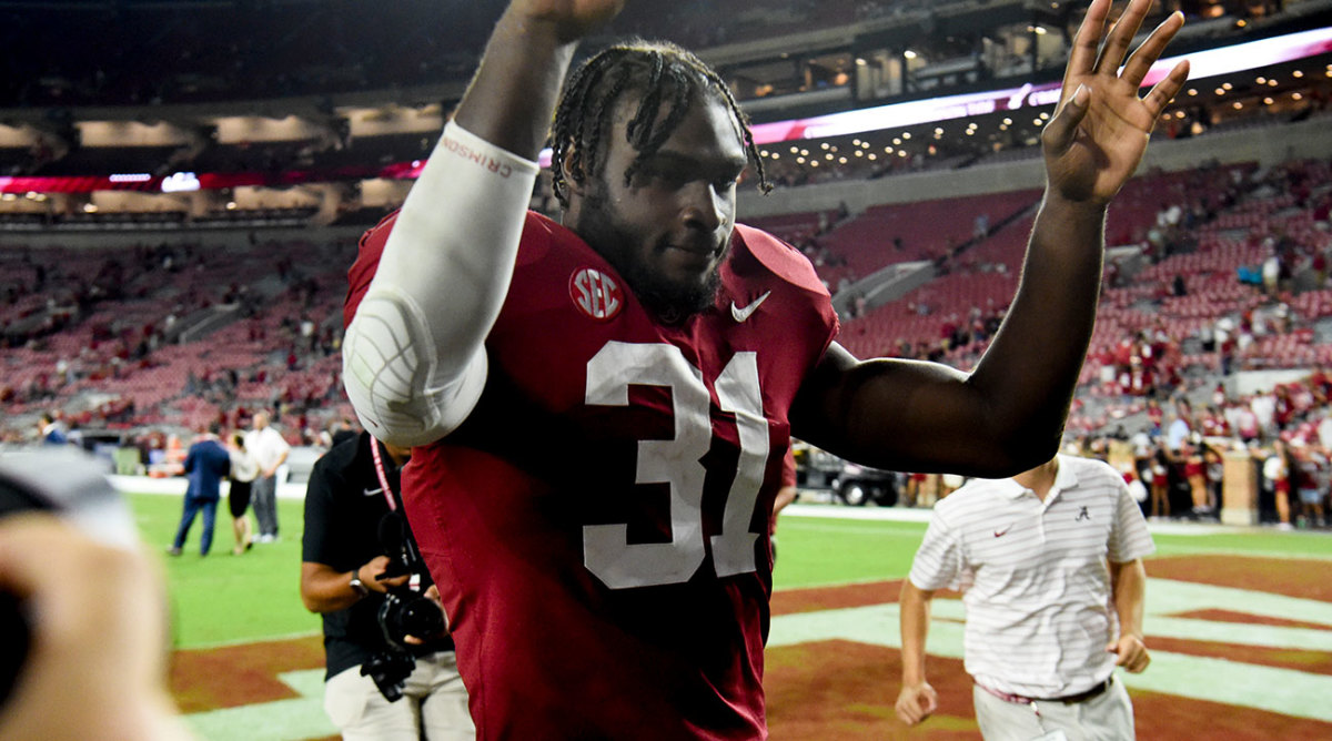 Will Anderson leaves the field after a game for Alabama.